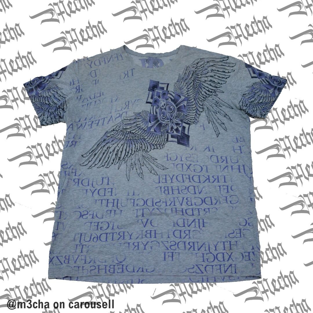 Light Grey Affliction Vibe AOP Winged Cross Spellout On Back (Category: Tshirts & Polo Shirts ) located in Manila. Submitted by m3cha (Listing ID 1352924432, Image 1). Description: Light Grey Affliction Vibe AOP Winged Cross Spellout On Back ----------------------------------------------------------- SIZING: cut tag unknown spellout on back "nbiolity" affliction vibe? fits L-XXL 23x29 ----------------------------------------------------------- IS