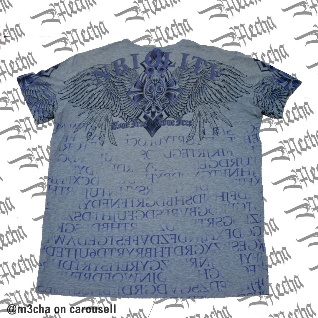 Light Grey Affliction Vibe AOP Winged Cross Spellout On Back (Category: Tshirts & Polo Shirts ) located in Manila. Submitted by m3cha (Listing ID 1352924432, Image 2). Description: Light Grey Affliction Vibe AOP Winged Cross Spellout On Back ----------------------------------------------------------- SIZING: cut tag unknown spellout on back "nbiolity" affliction vibe? fits L-XXL 23x29 ----------------------------------------------------------- IS