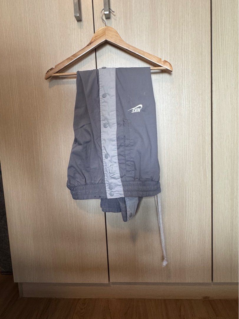 Nike AF-1 Tearaway Jogger Pants (Category: Joggers) located in Taguig. Submitted by jcs86 (Listing ID 1352948480, Image 3). Description: Nike AF-1 Tearaway Jogger Pants Size: Large Issue: Barely noticeable pen stain on butt area. See photo. Drawstring waist and cuffed ankles ** Buyer books and shoulders shipping. **.