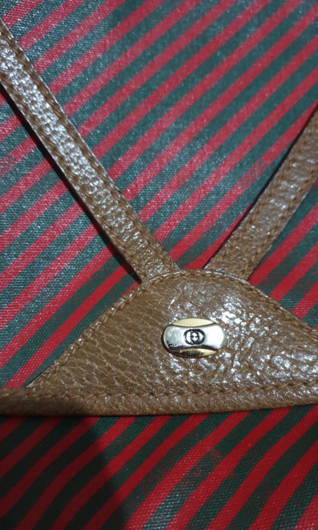 Authentic GUCCI Vintage Red Brown Clutch Bag (Category: Luxury Bags & Wallets) located in Manila. Submitted by graceperz (Listing ID 1353136270, Image 3). Description: Authentic Gucci originally bought in Italy Fold over front design Color red & brown leather detail Serial no shown in picture.