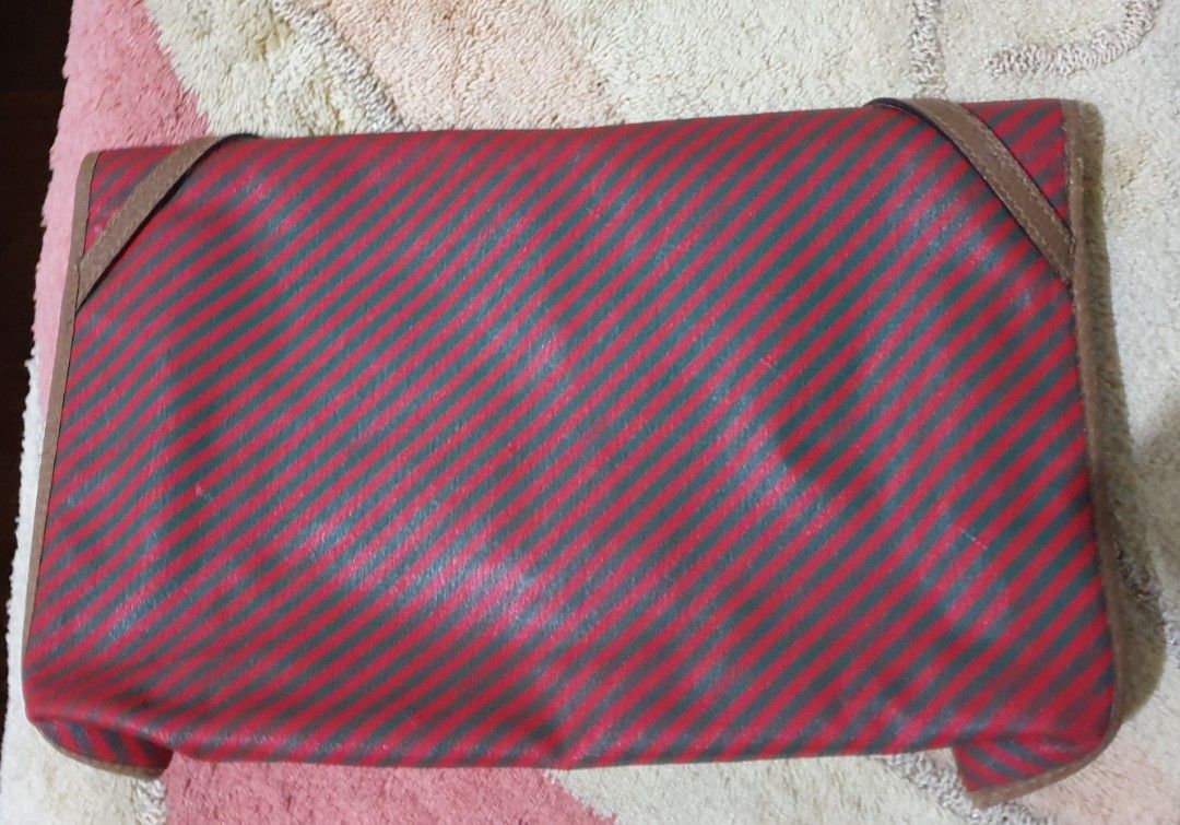 Authentic GUCCI Vintage Red Brown Clutch Bag (Category: Luxury Bags & Wallets) located in Manila. Submitted by graceperz (Listing ID 1353136270, Image 2). Description: Authentic Gucci originally bought in Italy Fold over front design Color red & brown leather detail Serial no shown in picture.