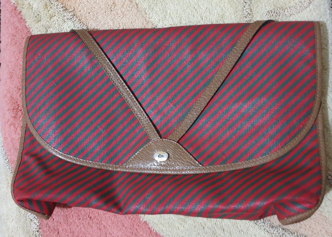 Authentic GUCCI Vintage Red Brown Clutch Bag (Category: Luxury Bags & Wallets) located in Manila. Submitted by graceperz (Listing ID 1353136270, Image 1). Description: Authentic Gucci originally bought in Italy Fold over front design Color red & brown leather detail Serial no shown in picture.