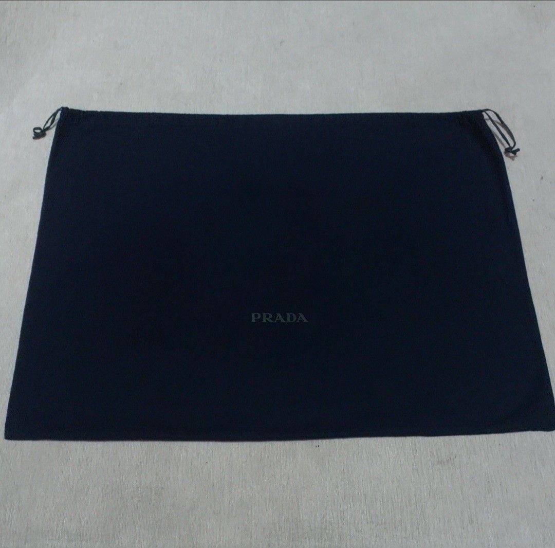 Authentic Prada dust bag 20x27.5 inches (Category: Luxury Bags & Wallets) located in Manila. Submitted by jfluxury.co (Listing ID 1353072216, Image 2). Description: excellent condition no flaws bought in Japan 🇯🇵 💯% Authentic. 😊 Money back guarantee. 😊 Clean and ready to use na.