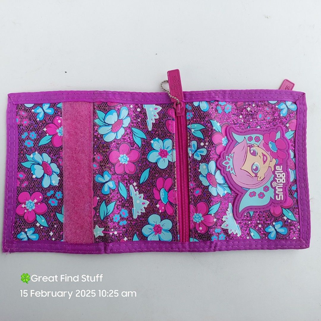 [GFS] Smiggle Wallet (Category: Wallets & Card holders) located in Quezon City. Submitted by greatfindstuff (Listing ID 1353044384, Image 2). Description: Smiggle Wallet Butterfly with Zip Pockets Like new (with small pen mark check last picture) •4 card slot • zipper compartment for bills • 25cm × 8.5cm × 1.5cm 📍Novaliches, Quezon City based 🛵 Lalamove•Grab•angkas pick up 💰 Gcash • BPI • BDO • Cash on Pick up.