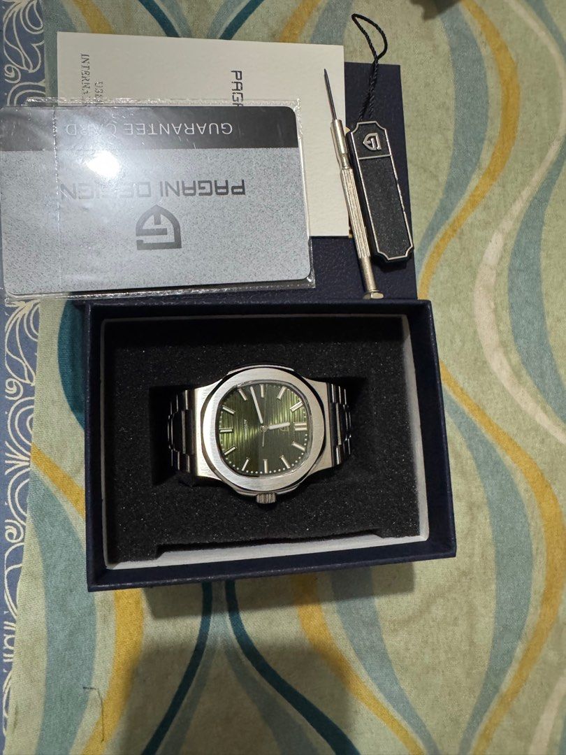 Pagani Design Green Nautilus (Category: Men's Watches) located in San Pedro. Submitted by ea7sys (Listing ID 1353176351, Image 2). Description: Pagani Design Nautilus Watch Green Dial With Logo Only Sapphire Crystal Gorgeous Watch, Well built Automatic - Seagull ST6 Movement Only used once RFS - freeing slots in my watch box for new watch .