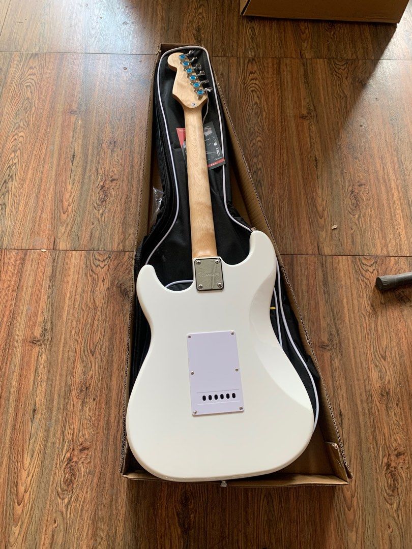 Thomson white stratocaster electric guitar (Category: Musical Instruments) located in Apalit. Submitted by angelic.archives (Listing ID 1353101449, Image 3). Description: PICK THIS UP AT ISKALA MUSIC STORE, APALIT, PAMPANGA 🎸THOMSON ST-1 stratocaster 🎸BRANDNEW ELECTRIC GUITAR Fret: 22 Body: Solid Ash Wood Neck: Rosewood / Maple wood Fingerboard: Rosewood Pickup: S-S-S Controls:1V+2T Scale Length: 25-1/2" (648) Machine Head: Diecast 🎸 Freebies: