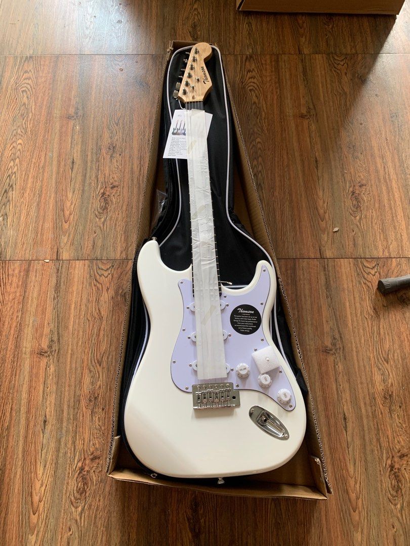 Thomson white stratocaster electric guitar (Category: Musical Instruments) located in Apalit. Submitted by angelic.archives (Listing ID 1353101449, Image 1). Description: PICK THIS UP AT ISKALA MUSIC STORE, APALIT, PAMPANGA 🎸THOMSON ST-1 stratocaster 🎸BRANDNEW ELECTRIC GUITAR Fret: 22 Body: Solid Ash Wood Neck: Rosewood / Maple wood Fingerboard: Rosewood Pickup: S-S-S Controls:1V+2T Scale Length: 25-1/2" (648) Machine Head: Diecast 🎸 Freebies: