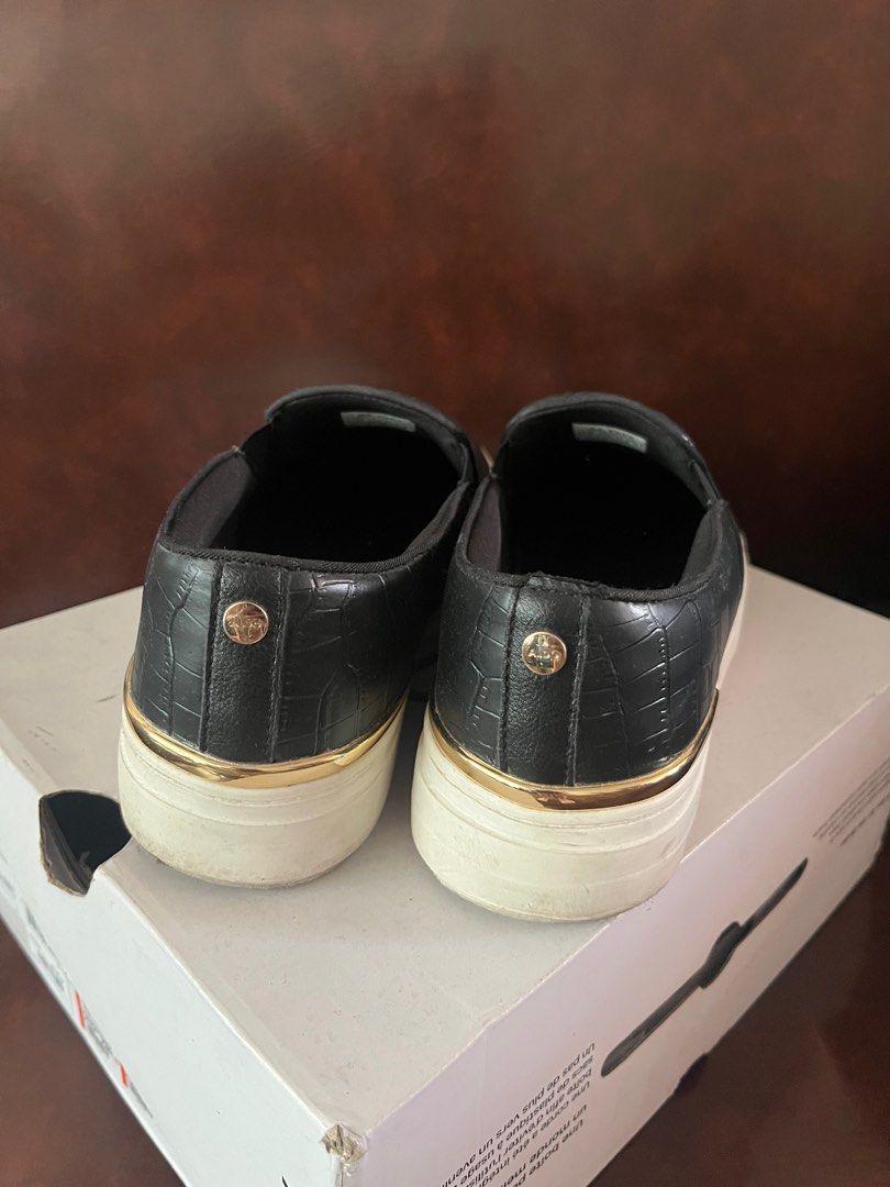Aldo Slip-on Shoes (Category: Sneakers) located in Quezon City. Submitted by assdeclutters (Listing ID 1353224356, Image 2). Description: Please see last photo for the flaw. Just glue residue as I used anti-slip cause size is a bit big for me. Size 7.5. What you see is what you get. Rfs: impulsive buy & size runs big.