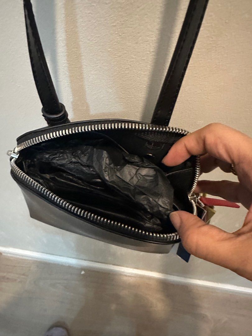 Charles & Keith Carey Crossbody Bag (Category: Cross-body Bags) located in Manila. Submitted by mal.eficent (Listing ID 1353390347, Image 2). Description: Authentic Charles & Keith Carey Crossbody Bag Size: Small Color: Black Bought in C&K SM Aura for 3k+ *Never get to use it. Too small for my stuff and abubuts* This is perfect for as your casual outfit accesories. The colorful charm details on the zipper is really an eye-catcher. Meetups in BGC 
