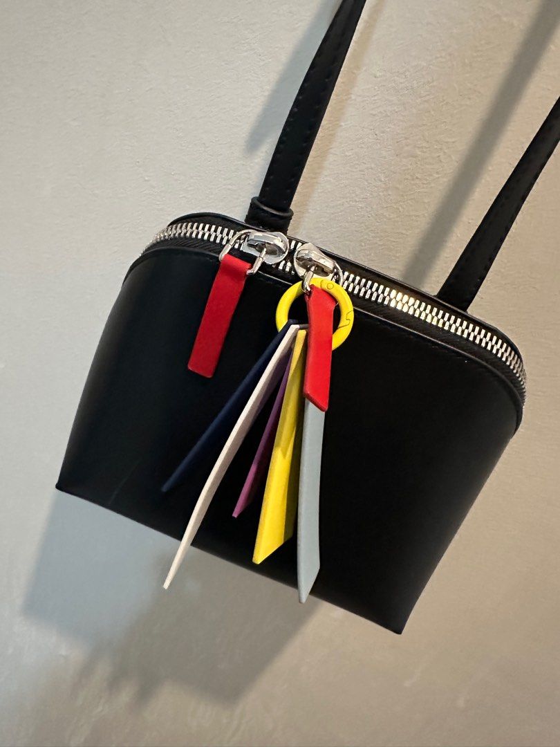 Charles & Keith Carey Crossbody Bag (Category: Cross-body Bags) located in Manila. Submitted by mal.eficent (Listing ID 1353390347, Image 1). Description: Authentic Charles & Keith Carey Crossbody Bag Size: Small Color: Black Bought in C&K SM Aura for 3k+ *Never get to use it. Too small for my stuff and abubuts* This is perfect for as your casual outfit accesories. The colorful charm details on the zipper is really an eye-catcher. Meetups in BGC 