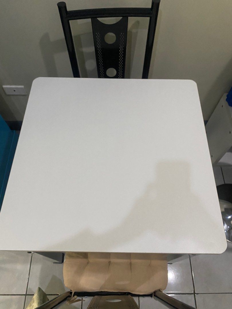 Dining Table (Pure WHITE) (Category: Other Kitchenware & Tableware) located in Mandaluyong City. Submitted by diamondzee (Listing ID 1353340449, Image 1). Description: Dining Table only Pure White Square 90x90 Good as new, no scratches High Quality Wood on top, and metal on feet 3K only.