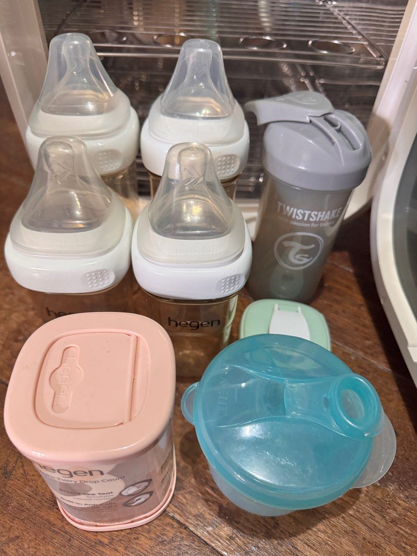 Ecomom only (inclusion sold) (Category: Breastfeeding & Bottle Feeding) located in Pasig City. Submitted by mythingstogo (Listing ID 1353249265, Image 2). Description: - excellent used condition - with minor discoloration (yellowish) due to storage since its color white Inclusion : - 4 hegen bottles (2pcs - 8oz / 2pcs - 11oz) - with extra unused cover and nipple (hegen) - hegen sip cover - twist and shake - avent milk container *Everything is wel