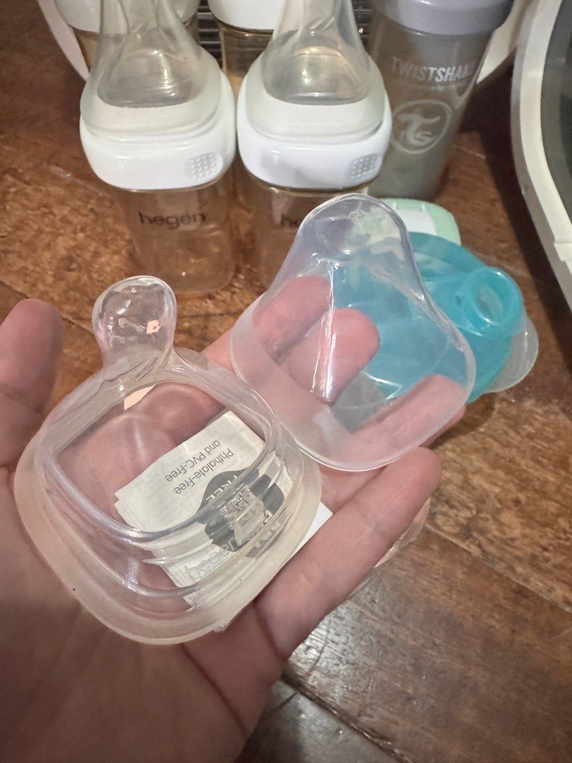 Ecomom only (inclusion sold) (Category: Breastfeeding & Bottle Feeding) located in Pasig City. Submitted by mythingstogo (Listing ID 1353249265, Image 3). Description: - excellent used condition - with minor discoloration (yellowish) due to storage since its color white Inclusion : - 4 hegen bottles (2pcs - 8oz / 2pcs - 11oz) - with extra unused cover and nipple (hegen) - hegen sip cover - twist and shake - avent milk container *Everything is wel