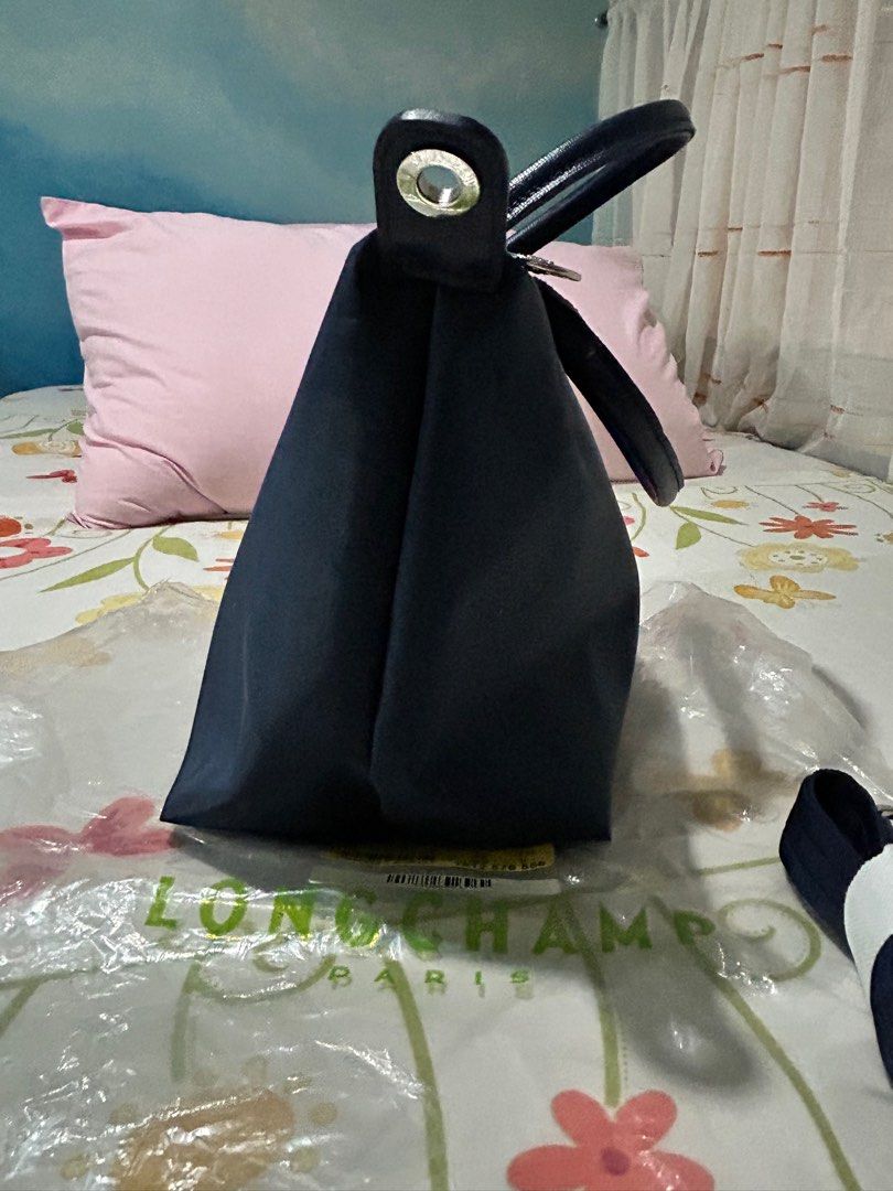 Longchamp Le Pliage Neo S Navy (Category: Luxury Bags & Wallets) located in Quezon City. Submitted by la_senorita.bcn (Listing ID 1353215049, Image 3). Description: Longchamp Le Pliage Neo Top Handle Small in Navy Blue. Made in France. In very good condition. Bought at Longchamp store in Barcelona. Please note this is the classic Neo (earlier release) so the removable strap is not adjustable but bag still hangs nicely just below waist (I’m 4’11”)