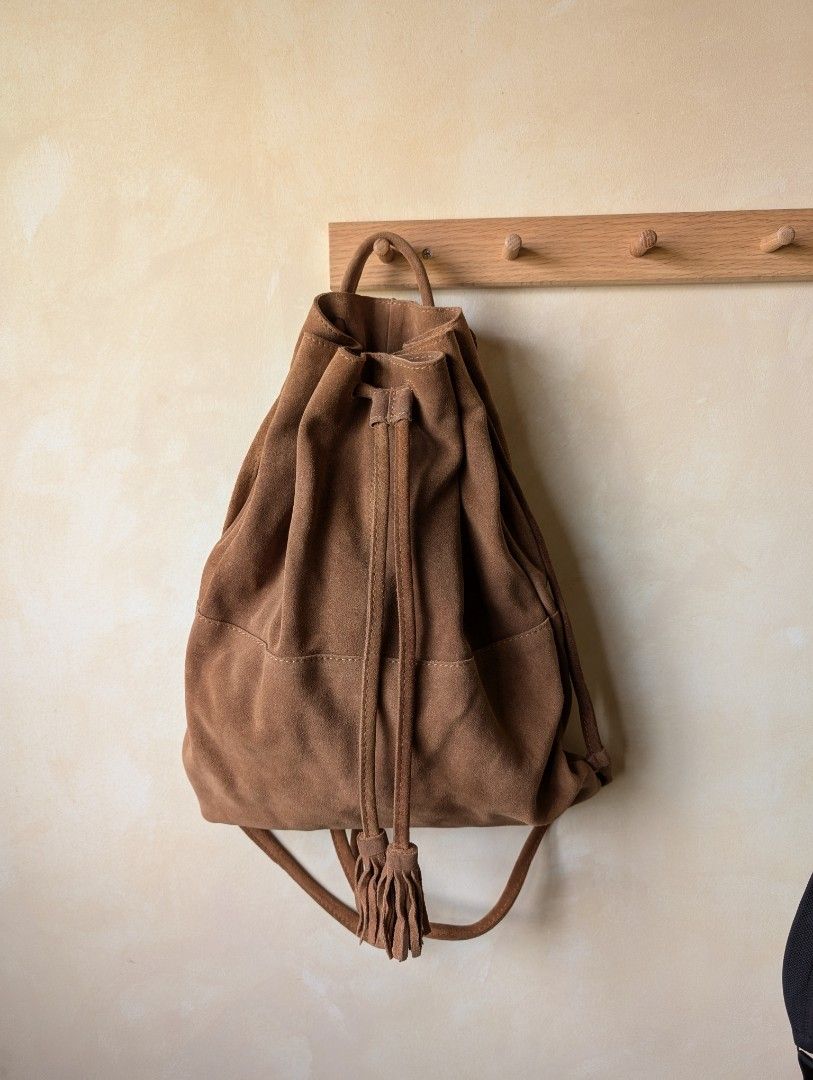 Mango Suede Drawstring Backpack (Category: Backpacks) located in Singapore. Submitted by moonbound (Listing ID 1353296492, Image 1). Description: Suede material. Feels premium and high quality. Bag is perfect for festivals.