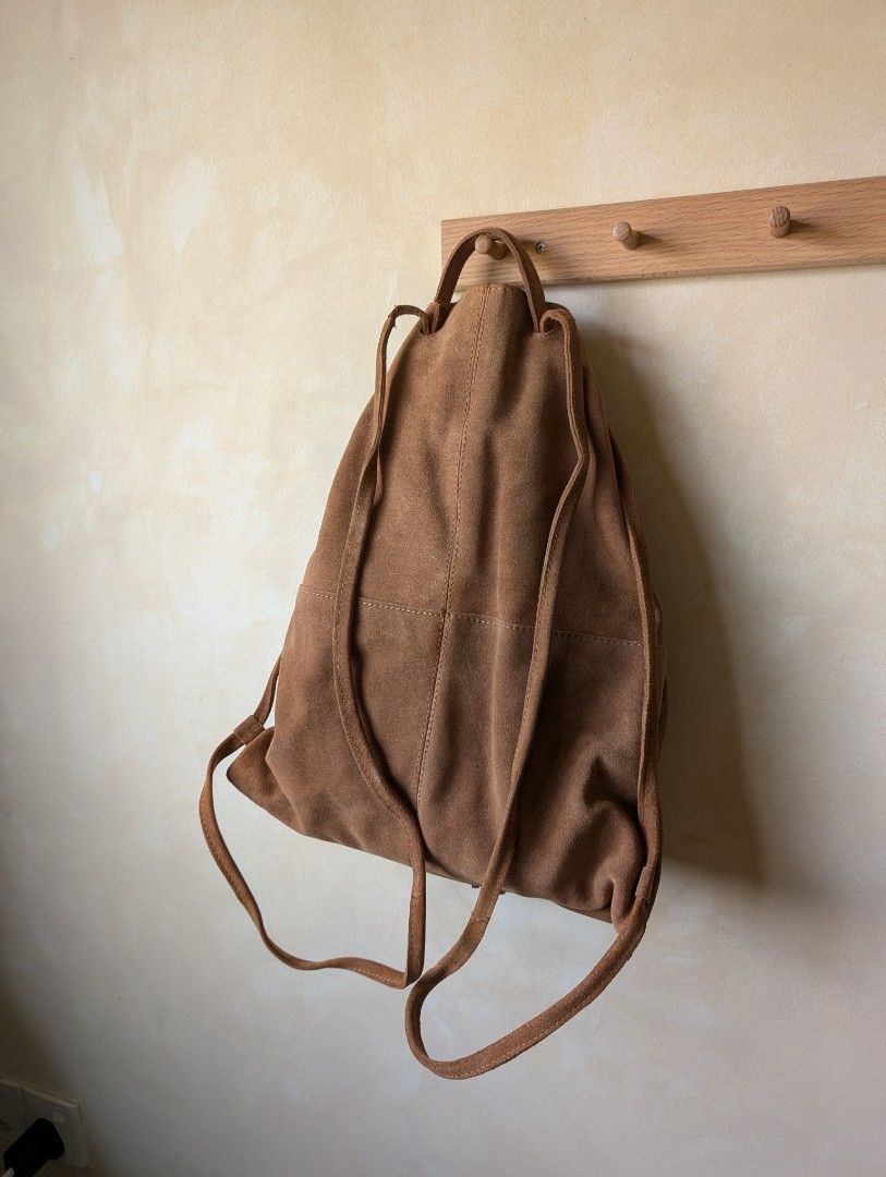 Mango Suede Drawstring Backpack (Category: Backpacks) located in Singapore. Submitted by moonbound (Listing ID 1353296492, Image 3). Description: Suede material. Feels premium and high quality. Bag is perfect for festivals.