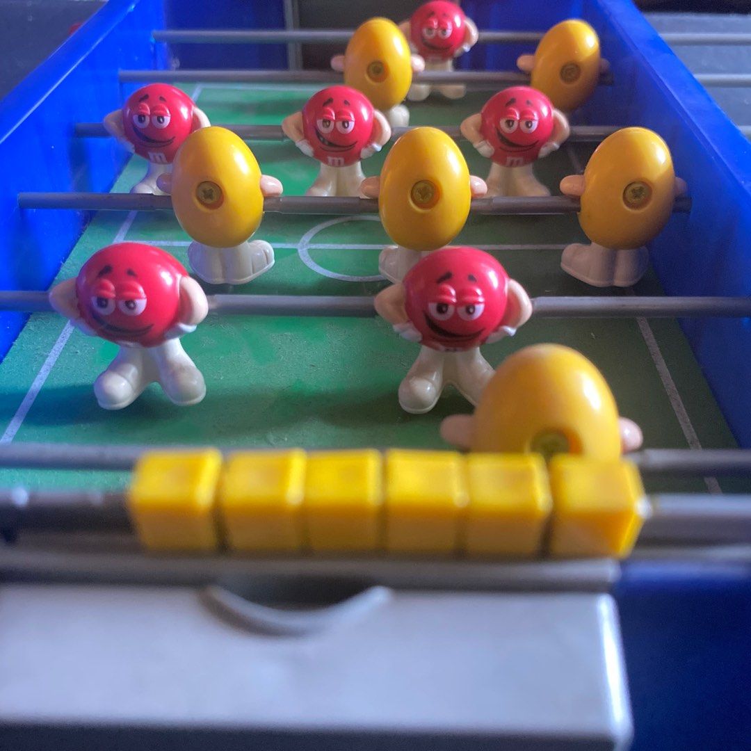 M&M Tabletop Mini Rod Soccer Table Foosball Game Plastic (Category: Board Games & Puzzles) located in Manila. Submitted by allmustgomnl (Listing ID 1353252323, Image 3). Description: M&M Foosball Super rare! Mint condition Table top Comes with 6 balls P1800 Collectible Length of field (doors up): 9" (23cm) Length of field (doors down): 10.75" (27.3cm) Width of field: 5.3" (13.5cm) Condition: Pre-owned, mint condition MOP Bank transfer Delivery bu