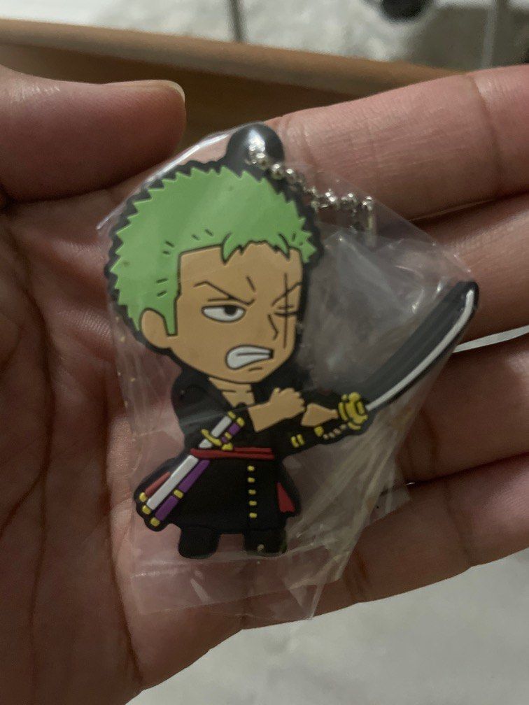 One Piece Keychain - Roronoa Zoro - Bandai Gashapon Japan (Category: J-Wave Merchandise) located in Singapore. Submitted by dreixwolfe (Listing ID 1353343147, Image 1). Description: From gashapon in Japan Can arrange trackable mail with additional fee .
