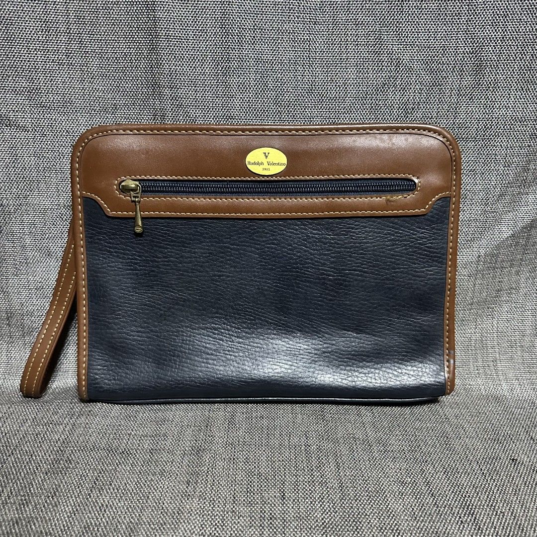 Rudolph Valentino clutch bag (Category: Luxury Bags & Wallets) located in Manila. Submitted by greyinfash06839 (Listing ID 1353342633, Image 1). Description: 🤍Price: 3,900 pesos only 🤍Item: Rudolph Valentino clutch bag 🤍Brand: Rudolph Valentino 🤍Matirial: Leather 🤍Quality: Original 🤍color: Blue 🤍Size: Medium 🤍Dimension. H: 8 L: 11 W: 2 🤍Sex: For Men 🤍Issue: Sign of use 🤍Condition Rate: 9/10 🤍Other info:.