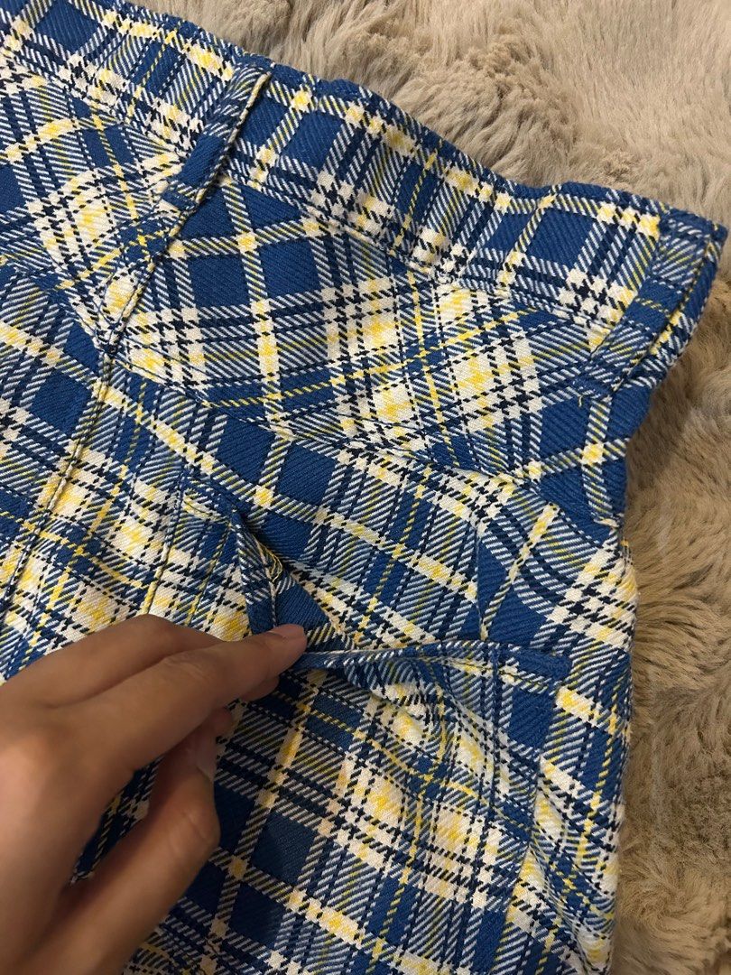 Blue and yellow plaid mini skirt (Category: Skirts) located in Las Pinas. Submitted by f___th (Listing ID 1353523974, Image 3). Description: Never worn before, skirt has back and front pockets as seen on the picture. Size is a perfect fit for those who are M !.