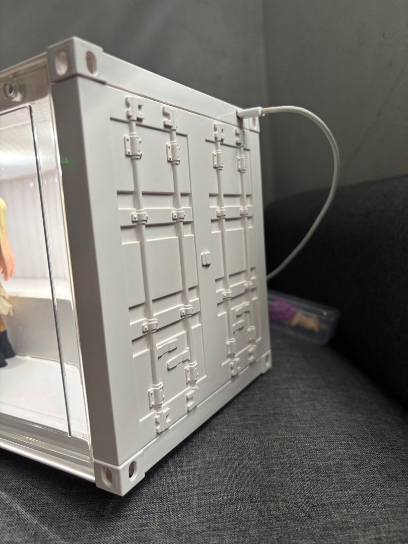 Display Case Container for Popmart figurines (Category: Designer & Blind Box Toys) located in Bulacan. Submitted by annpookiee (Listing ID 1353451143, Image 2). Description: with light! (type c) gooe condition pero x sensi :) check all the pics pls. can hold up to 12-17 figs. acry glass is ok may small scratches pero barely noticeable (can send more pics). rfs: i want the popmart transparent case. mop: gcash mod; lalamove.