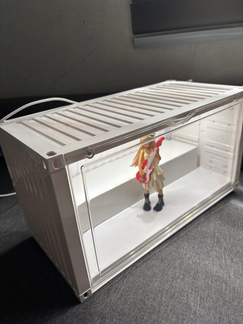 Display Case Container for Popmart figurines (Category: Designer & Blind Box Toys) located in Bulacan. Submitted by annpookiee (Listing ID 1353451143, Image 1). Description: with light! (type c) gooe condition pero x sensi :) check all the pics pls. can hold up to 12-17 figs. acry glass is ok may small scratches pero barely noticeable (can send more pics). rfs: i want the popmart transparent case. mop: gcash mod; lalamove.