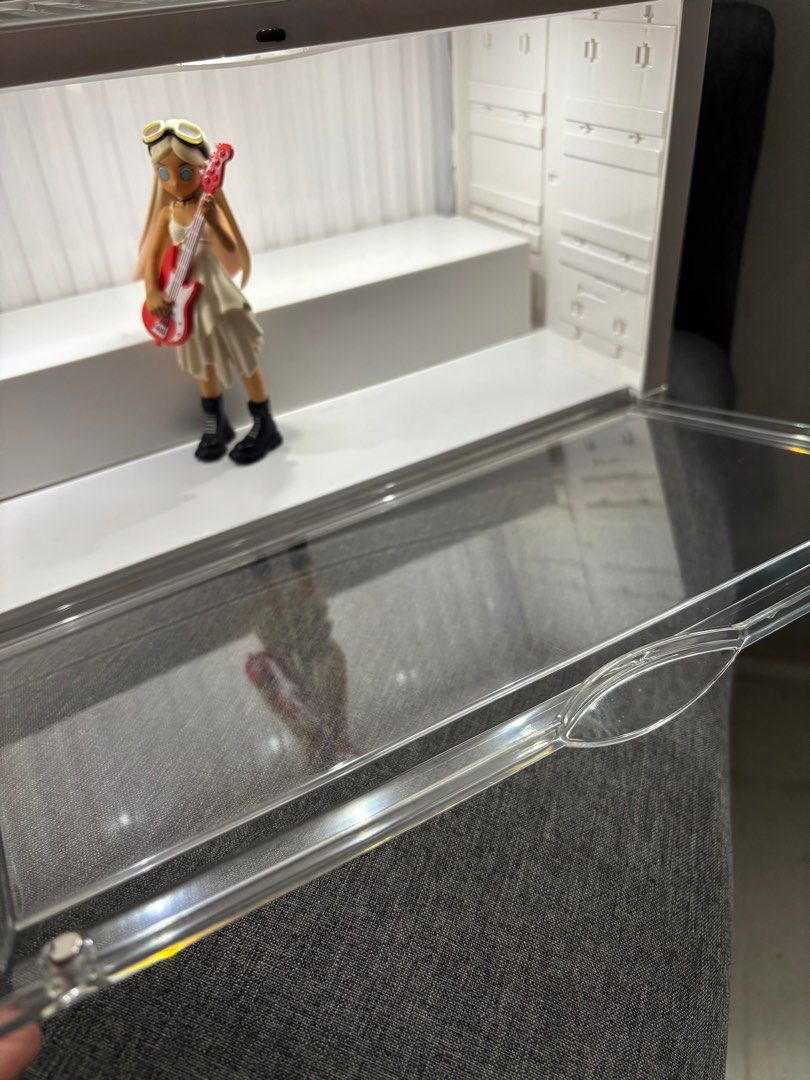 Display Case Container for Popmart figurines (Category: Designer & Blind Box Toys) located in Bulacan. Submitted by annpookiee (Listing ID 1353451143, Image 3). Description: with light! (type c) gooe condition pero x sensi :) check all the pics pls. can hold up to 12-17 figs. acry glass is ok may small scratches pero barely noticeable (can send more pics). rfs: i want the popmart transparent case. mop: gcash mod; lalamove.