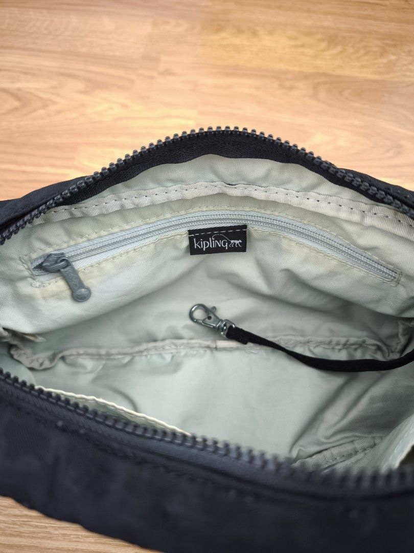 Kipling Sling Bag (Category: Cross-body Bags) located in Kuala Lumpur. Submitted by mkl_99 (Listing ID 1353434026, Image 2). Description: Kipling Sling Bag (Genuine) Main zip has been replaced.
