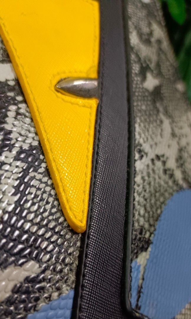 Rare Fendi Monster Python Leather Flat clutch / Pouch No code (Category: Luxury Bags & Wallets) located in Santa Maria. Submitted by prettyiu (Listing ID 1353438347, Image 3). Description: Rare Fendi Monster Python Leather Flat clutch / Pouch Excellent Condition No Code. Negotiable..