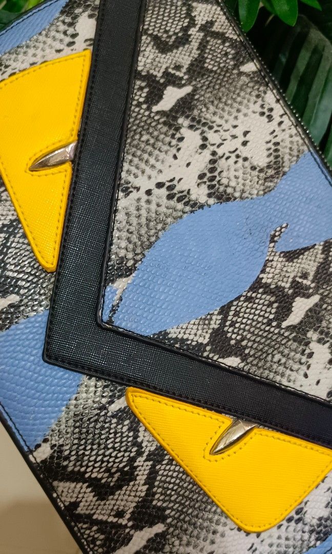 Rare Fendi Monster Python Leather Flat clutch / Pouch No code (Category: Luxury Bags & Wallets) located in Santa Maria. Submitted by prettyiu (Listing ID 1353438347, Image 2). Description: Rare Fendi Monster Python Leather Flat clutch / Pouch Excellent Condition No Code. Negotiable..