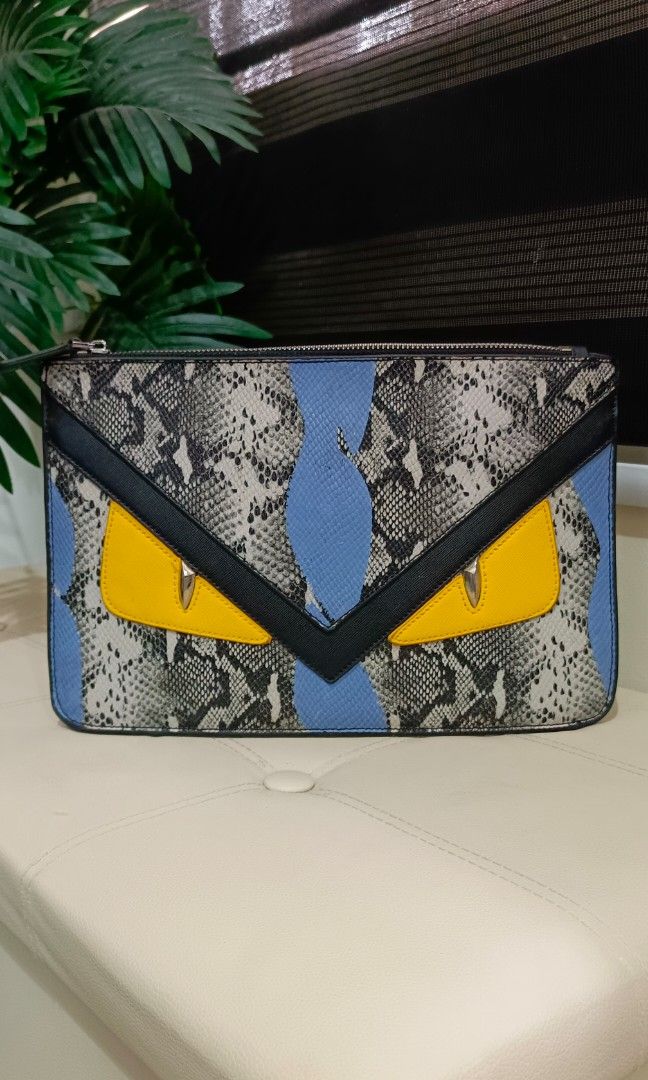 Rare Fendi Monster Python Leather Flat clutch / Pouch No code (Category: Luxury Bags & Wallets) located in Santa Maria. Submitted by prettyiu (Listing ID 1353438347, Image 1). Description: Rare Fendi Monster Python Leather Flat clutch / Pouch Excellent Condition No Code. Negotiable..