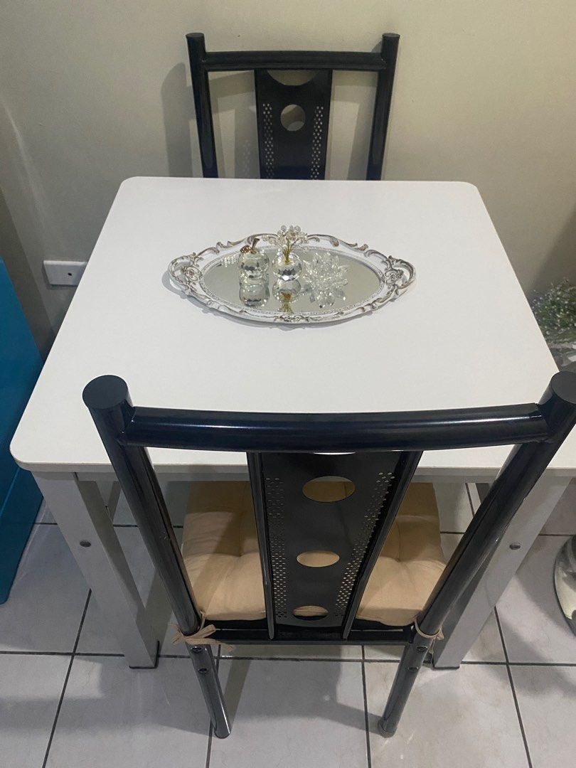 Dining Table (Pure WHITE) (Category: Other Kitchenware & Tableware) located in Mandaluyong City. Submitted by diamondzee (Listing ID 1353340449, Image 3). Description: Dining Table only Pure White Square 90x90 Good as new, no scratches High Quality Wood on top, and metal on feet 3K only.