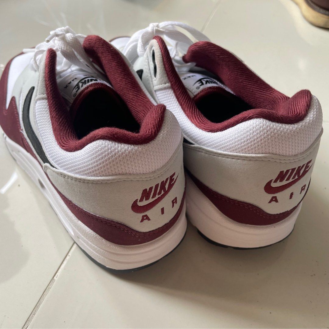 Nike Air Max 1 Dark Team Red Men (Category: Sneakers) located in Pasig City. Submitted by flkloresupply (Listing ID 1353611675, Image 3). Description: RFS: Decluttering Used once, a little stain by the top eyelet. Seems to be the same color as the red of the shoe. You can see it on the last pic. Size US 10/UK 9 Men. .