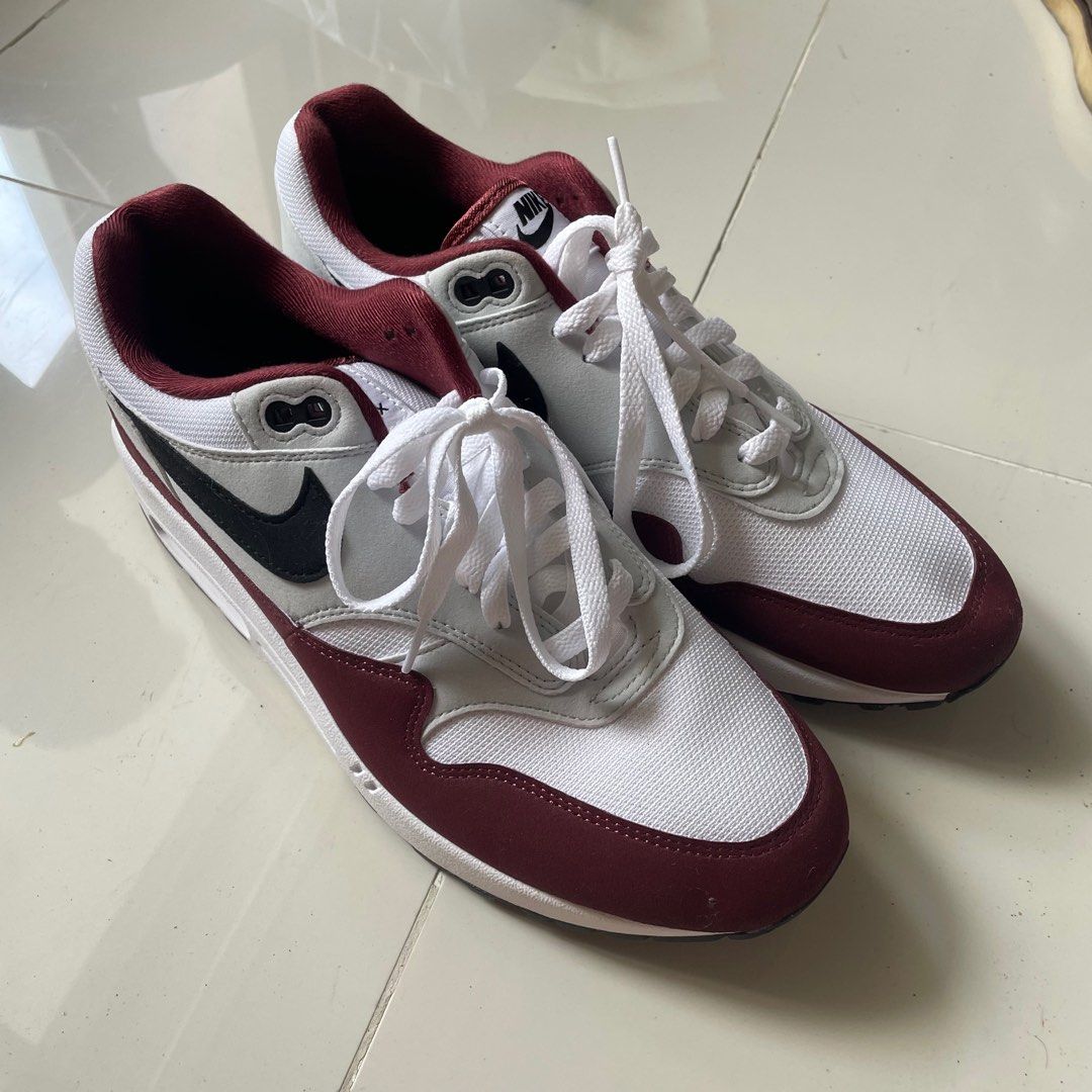 Nike Air Max 1 Dark Team Red Men (Category: Sneakers) located in Pasig City. Submitted by flkloresupply (Listing ID 1353611675, Image 2). Description: RFS: Decluttering Used once, a little stain by the top eyelet. Seems to be the same color as the red of the shoe. You can see it on the last pic. Size US 10/UK 9 Men. .
