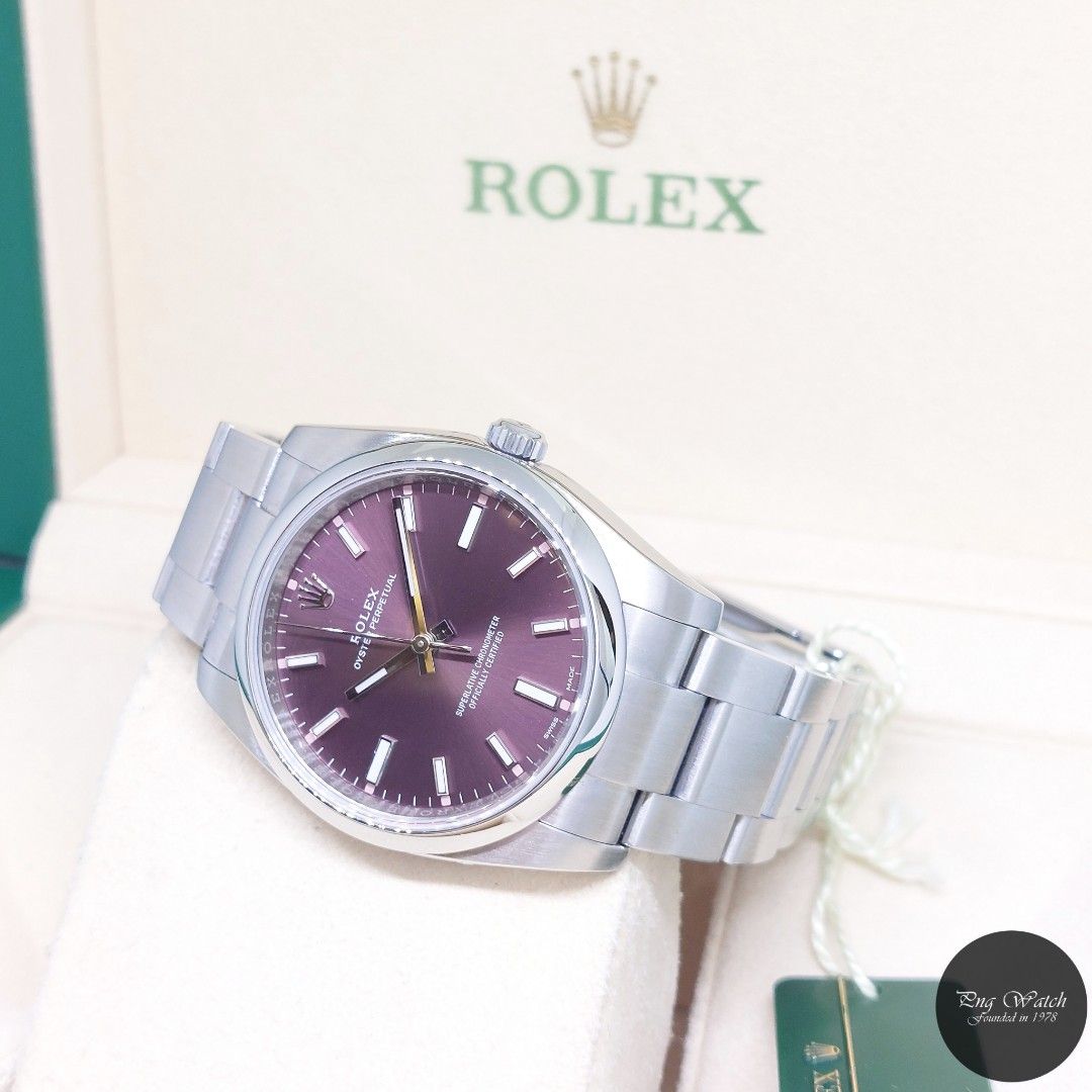 Rolex 34mm Purple Indexes Dial Oyster Perpetual REF: 114200 (2015) (Category: Watches) located in Singapore. Submitted by pngwatchdealer (Listing ID 1353766299, Image 1). Description: [SPECIFICATIONS] **Watch comes in full option (Box, Card & Tag)** Brand: Rolex Model: Oyster Perpetual (REF: 114200)(AN)(15)(O) Movement: Automatic (Self-Winding) Functions and Features: Hours, Minutes and Seconds (CASE) Case Material: Stainless Steel Case Diameter: