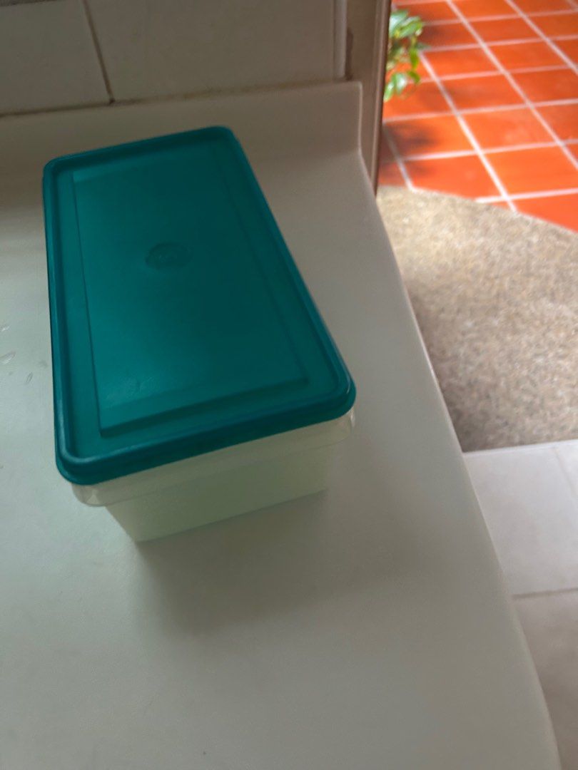 Tupperware - rectangular storage (Category: Other Kitchenware & Tableware) located in Singapore. Submitted by adnicate (Listing ID 1353697020, Image 1). Description: Dimensions 12.5 x 28cm x 9cm (H).