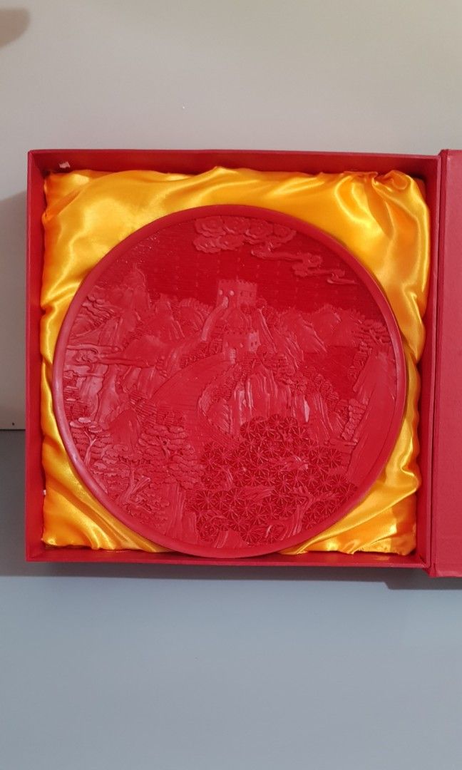 Chinese Red Lacquerware Mountain Tree Round Tray Plate (Category: Frames & Pictures) located in Taguig. Submitted by thrifthub.ph (Listing ID 1329299305, Image 2). Description: Material: Made of lacquerware, a traditional Chinese craft with a history dating back to the Neolithic period. Design: Features a detailed carving of the Great Wall, showcasing its structure and surrounding landscape. Craftsmanship: Created using techniques such as palm pu