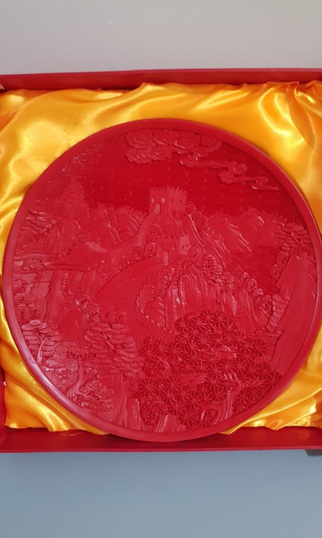 Chinese Red Lacquerware Mountain Tree Round Tray Plate (Category: Frames & Pictures) located in Taguig. Submitted by thrifthub.ph (Listing ID 1329299305, Image 1). Description: Material: Made of lacquerware, a traditional Chinese craft with a history dating back to the Neolithic period. Design: Features a detailed carving of the Great Wall, showcasing its structure and surrounding landscape. Craftsmanship: Created using techniques such as palm pu