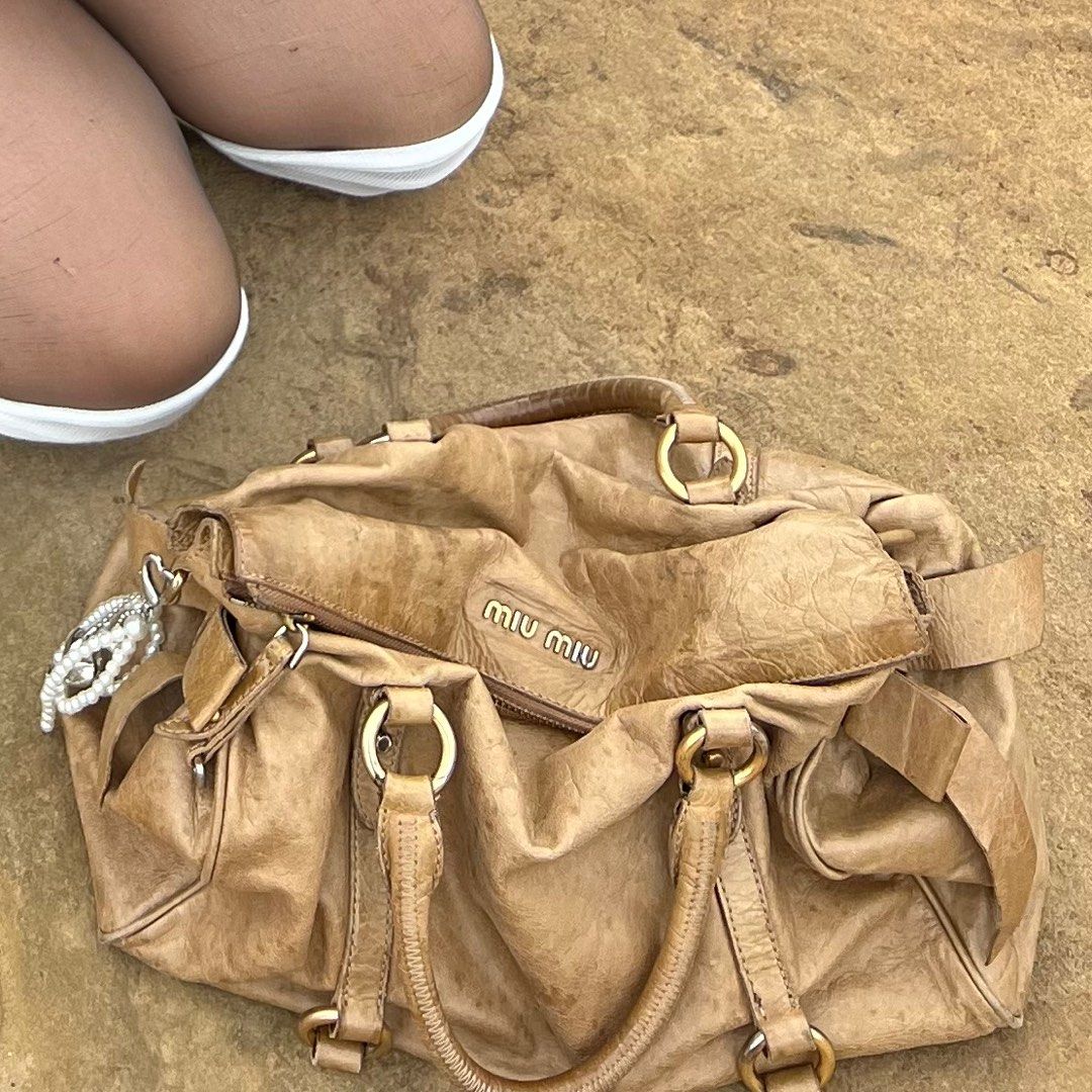 Authentic Miu miu 2 way Bow Handbag (Category: Luxury Bags & Wallets) located in Makati City. Submitted by jess.tv (Listing ID 1350865474, Image 2). Description: RFS: Decluttering Flaws: Severe molds (kayo na pa magpa restore).