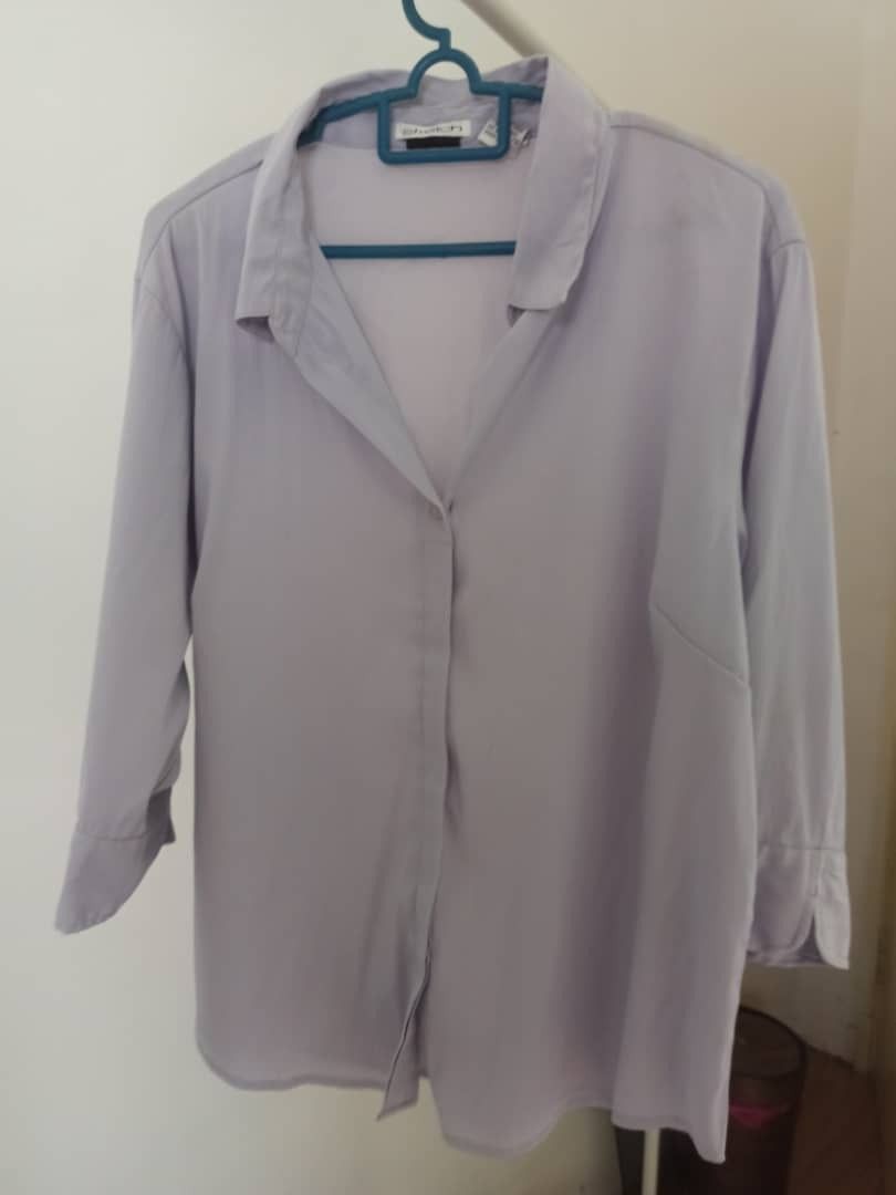 Button Blouse (Category: Blouses) located in Semenyih. Submitted by plovelee (Listing ID 1350852973, Image 1). Description: Condition : 8/10 Material : Polyester Style : 3 quarter sleeves Colour : Lilac Postage : RM7 Chat for more details.