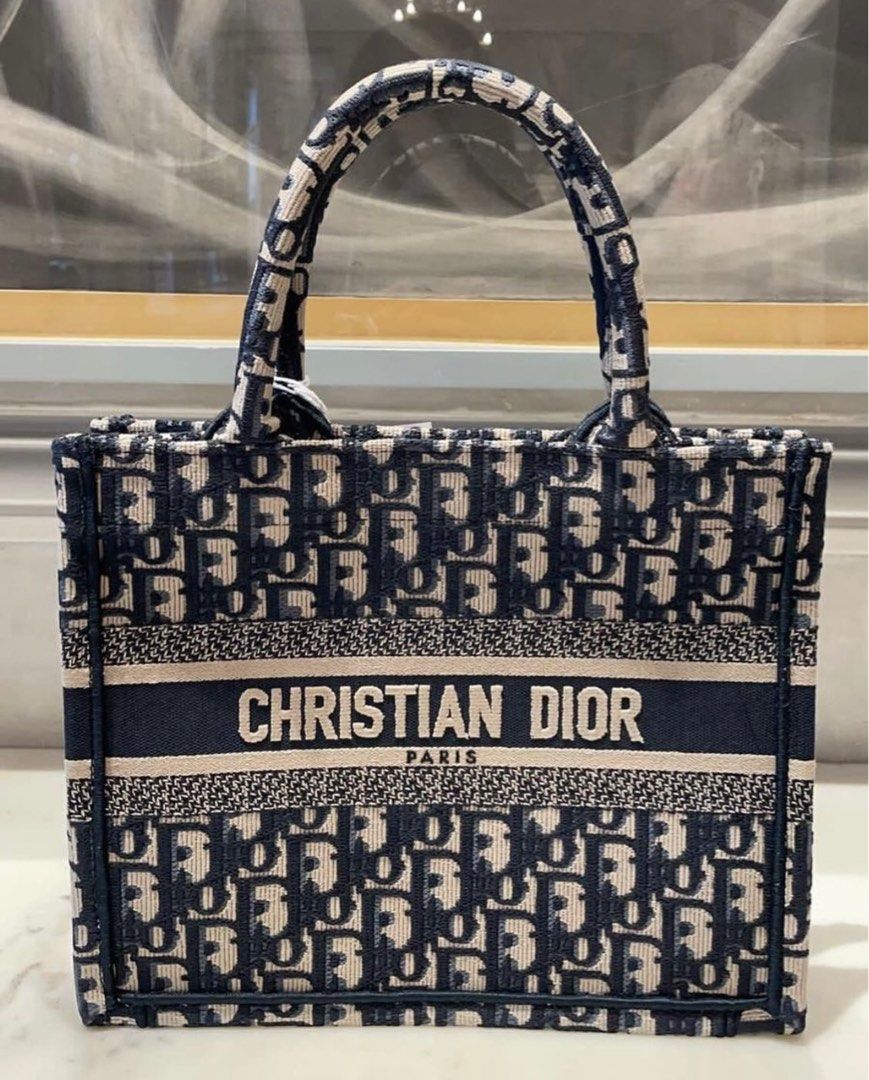Dior Book Tote Medium (Category: Luxury Bags & Wallets) located in Quezon City. Submitted by mitsiandres (Listing ID 1350754749, Image 1). Description: Brandnew From Paris, France Comes with authenticity cards and dust bag SRP 200,000 PHP Main composition: cotton Christian Dior Paris signature on the front Dust bag included Size & Fit: Dimensions: 36 x 27.5 x 16.5 cm / 14 x 11 x 6.5 inches (Length x Height x Width) The bag’s large size can accomm