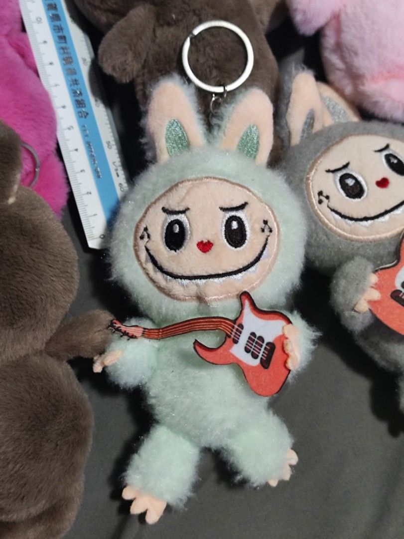 Labubu INSPIRED Charms Keychains Stuffed Toy plushie (Category: Plushies & Soft Toys) located in Muntinlupa City. Submitted by dondi12 (Listing ID 1350848746, Image 3). Description: Labubu INSPIRED Charms Keychains Stuffed Toy plushie Note : INSPIRED ONLY Negotiable, can do bulk sale/take all 40 each Location: Bayanan Muntinlupa.