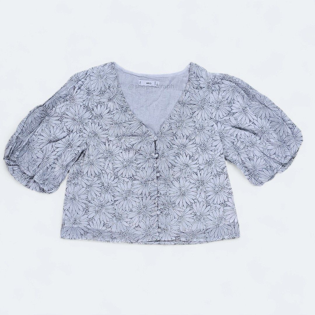 Mango Cropped Cotton Puff Sleeve Blouse (Category: Blouses) located in Paranaque City. Submitted by shopextraph (Listing ID 1350737463, Image 1). Description: [Pre-owned] Mango Cropped Cotton Puff Sleeve Blouse Front closure, V-neck, Light fabric, 100% Cotton, Standard design, Floral print, Straight design, V-neck, Short sleeve, Button up, Interior cotton lining, Total look. 100% cotton. EU Small. US 4. Used around 4x. No other inclusions. Photos