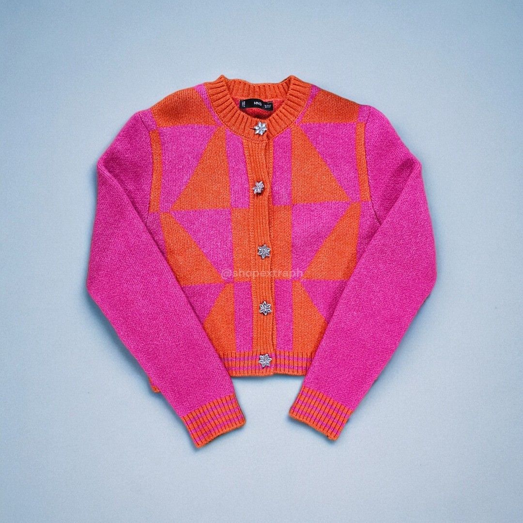 Mango Knitted Cardigan w/ Jewel Button (Category: Coats, Jackets and Outerwear) located in Paranaque City. Submitted by shopextraph (Listing ID 1350743303, Image 1). Description: [Pre-owned] Mango Knitted Cardigan w/ Jewel Button Wool mix fabric.Medium Knit. Straight design. Cropped design. Argyle Print. Round neck. Button fastening on the front section. Jewel effect buttons. Long sleeve. Color: Fuchsia Size: EU US Small Used 3x. No other inclusi