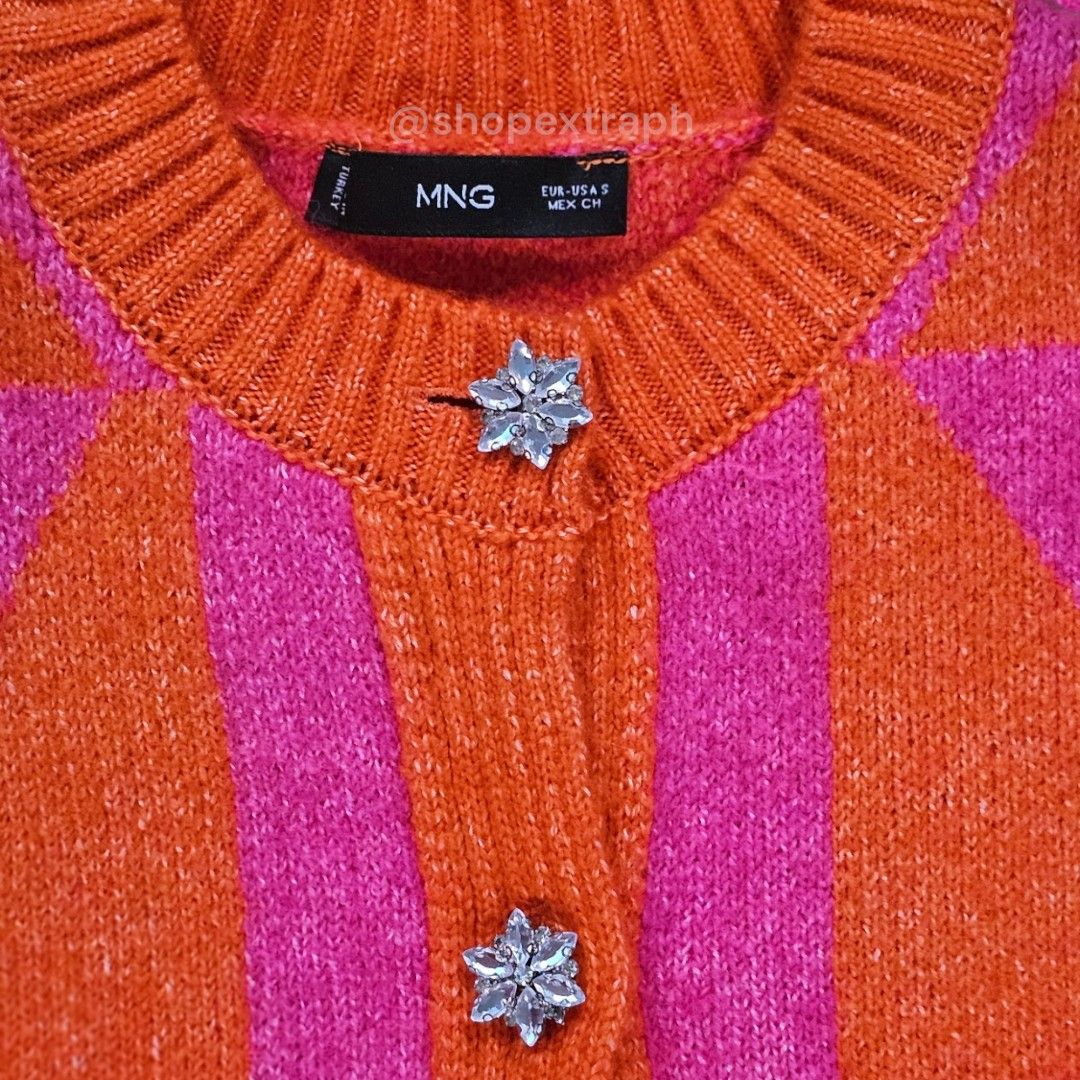 Mango Knitted Cardigan w/ Jewel Button (Category: Coats, Jackets and Outerwear) located in Paranaque City. Submitted by shopextraph (Listing ID 1350743303, Image 3). Description: [Pre-owned] Mango Knitted Cardigan w/ Jewel Button Wool mix fabric.Medium Knit. Straight design. Cropped design. Argyle Print. Round neck. Button fastening on the front section. Jewel effect buttons. Long sleeve. Color: Fuchsia Size: EU US Small Used 3x. No other inclusi