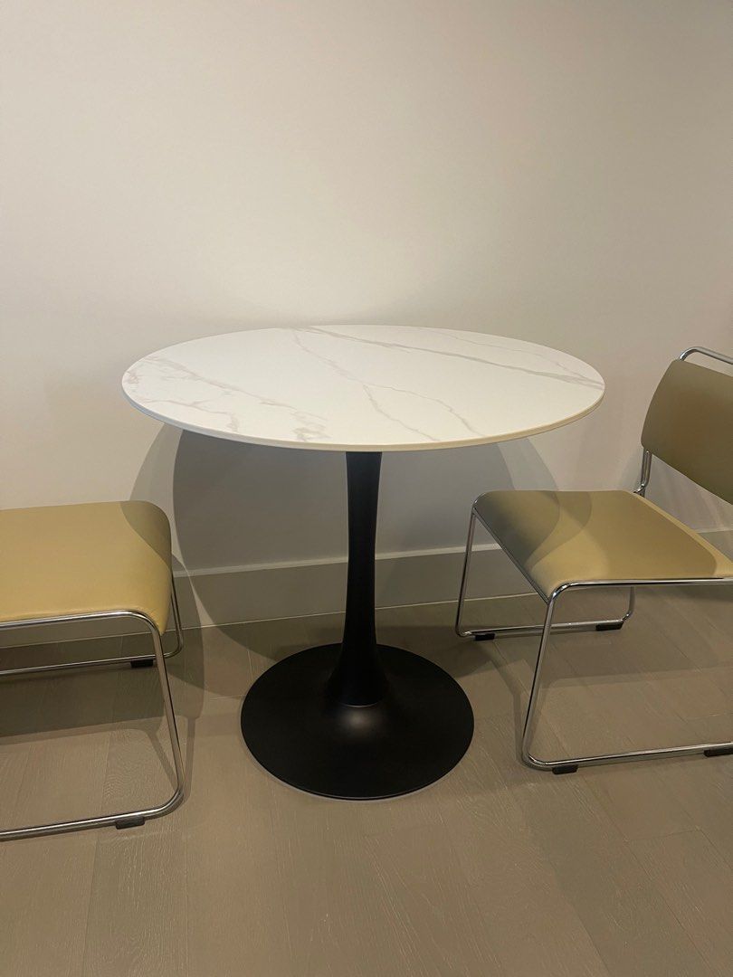 RUSH: Marble Finish Tulip Table for sale (Category: Tables & Sets) located in Quezon City. Submitted by bialogy (Listing ID 1349555791, Image 1). Description: Sintered stone tulip marble table for sale • Barely used! Made of sintered stone (a good choice because no need to worry so much about stains, and it’s durable!) • 80 cm diameter • 75 cm height • Fits 3 pax; 4 if not complete table setup (drinking, etc) RUSH SALE! • Can view in Marikina. • 