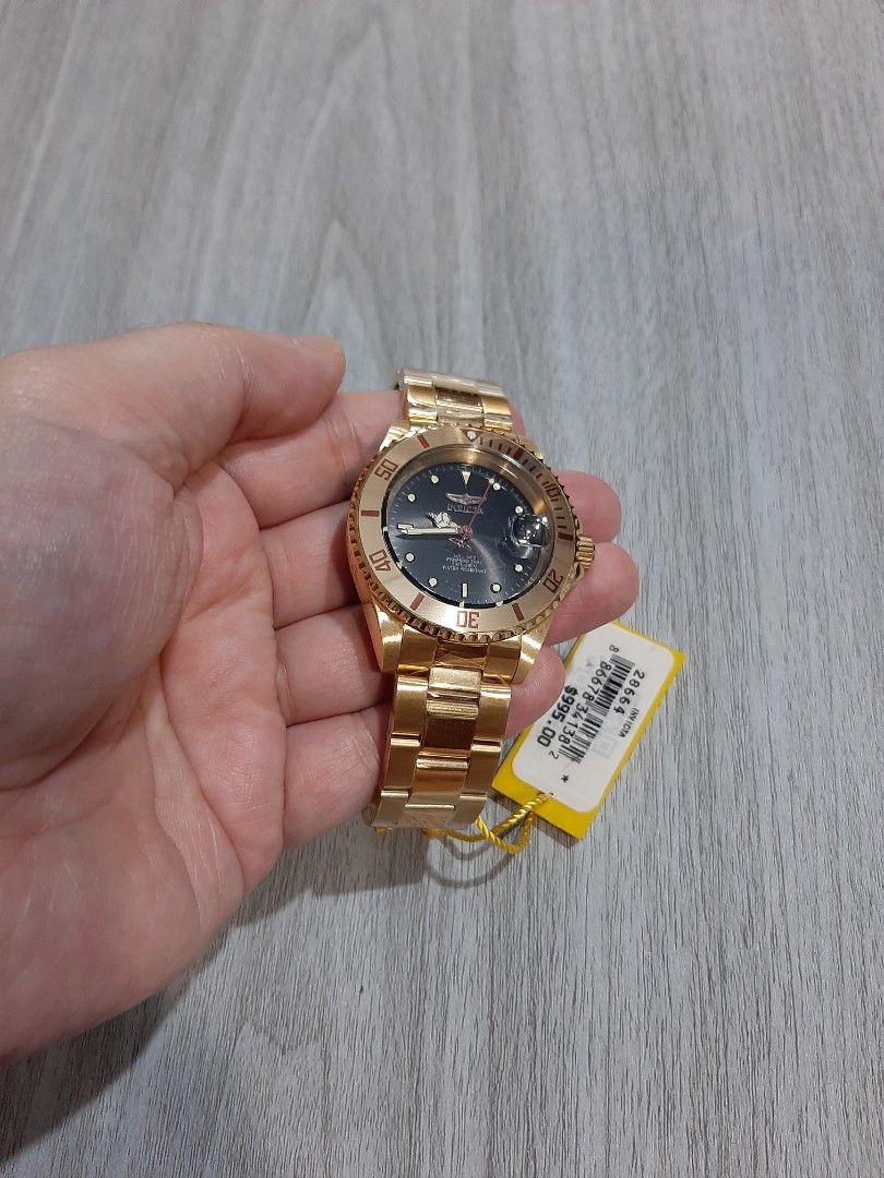 Original Invicta Pro Diver Automatic Unisex Watch (Category: Men's Watches) located in Mandaluyong City. Submitted by time_machine28 (Listing ID 1350850467, Image 2). Description: Ptpa, SALE...SALE...SALE... SALE...SALE...SALE... 6,800 pesos only Invicta Pro Diver Automatic Model 28664 Original/legit Brandnew Selling low Gold tone Black face Fit's up to 8 inches wrist Bought in u.s Unisex Size 40mm 09173459191 Mandaluyong here Mop:BDO or gcash Sr