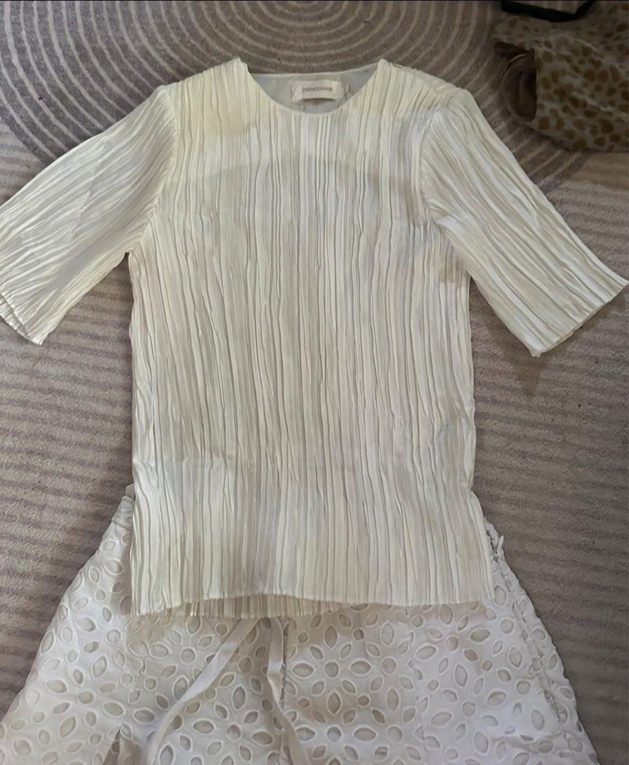 ZIMMERMANN RIOT PLISSE SCRUNCH TOP (Category: Blouses) located in Legazpi City. Submitted by gillesmonette (Listing ID 1350822876, Image 2). Description: ORIGINAL SIZE 0 on label SIZE SMALL KAYA til 34 bust complete necktag and hangtag.