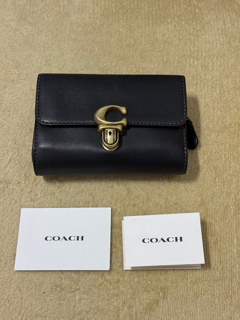RETAIL | Coach Studio Medium Wallet (Category: Luxury Bags & Wallets) located in San Pablo. Submitted by declutter_anel (Listing ID 1353994257, Image 1). Description: Coach Studio Medium wallet in color Black. This is a retail item and 💯 authentic. This is my everyday wallet since 2022. With normal signs of wear. This wallet can attest to the quality of coach products. Product Details: Glovetanned leather Ten credit card slots Full-length bill c