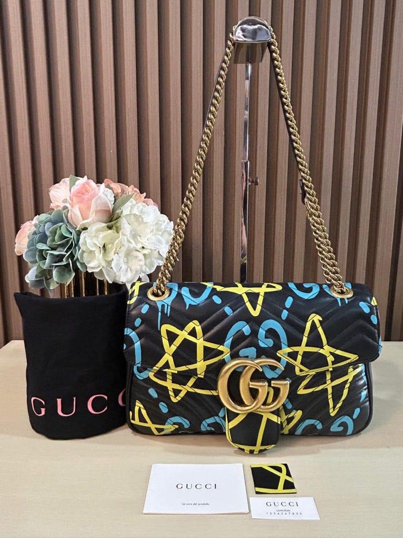 GG Medium Marmont Graffiti Shoulder Bag (Category: Luxury Bags & Wallets) located in Manila. Submitted by bagislifeshop (Listing ID 1354120387, Image 1). Description: ✅Condition: 8.8/10 ( Limited Ed) ✅Colour: Black and multicoloured graffiti ✅Size: 29 X 18 X 7CM ✅Inclusion: dustbag and cards .